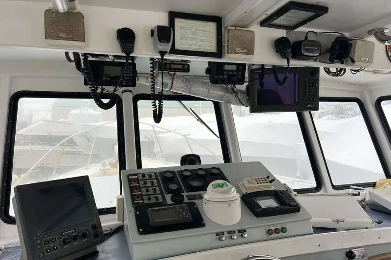 Slide: The Image of Interior of 1985 Young Brothers 40 boat with navigation equipment and control panel. - 10