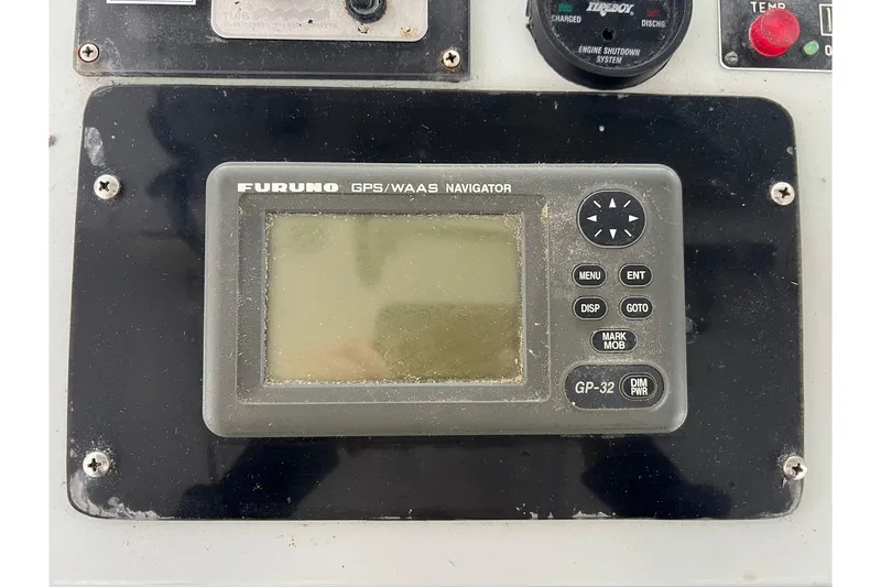 Slide: The Image of Furuno GPS/WAAS Navigator on Young Brothers 1985 model 40 control panel. - 5