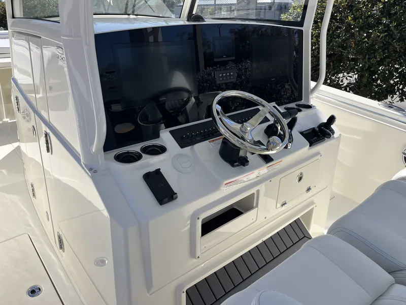 Slide: The Image of Cobia 350 Center Console 2026 helm with modern electronics. - 14