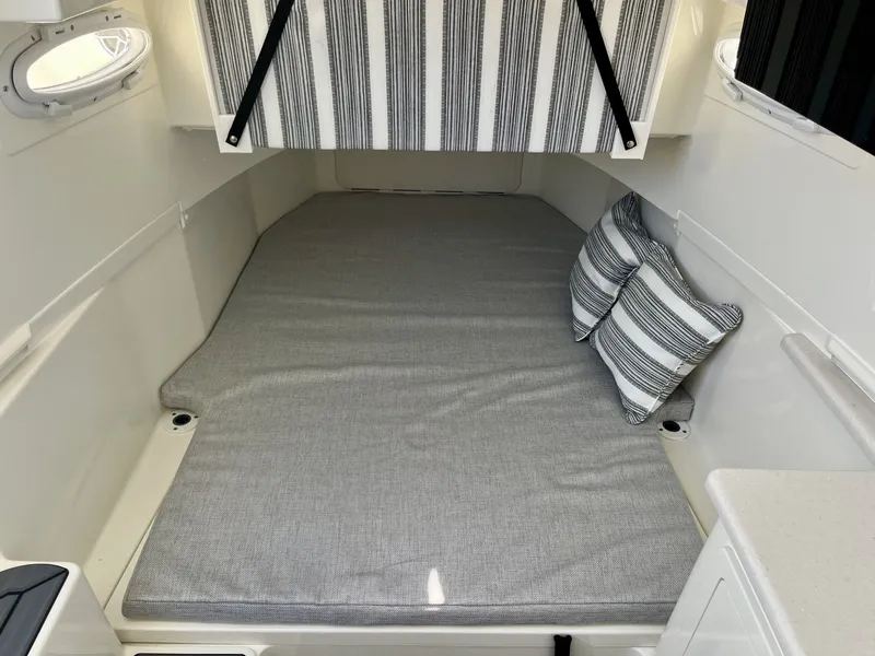Slide: The Image of Interior of 2026 Cobia 350 Center Console with gray bedding. - 24