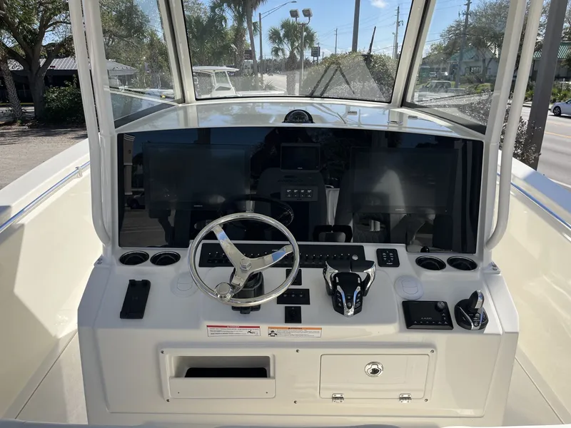 Slide: The Image of Cobia 350 Center Console 2026 helm with modern electronics. - 13