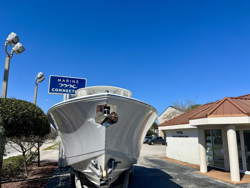 Slide: The Image of 2026 Cobia 350 Center Console at Marine Connection building. - 3