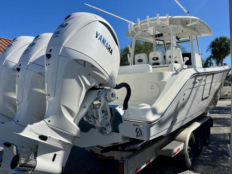 Slide: The Image of 2026 Cobia 350 Center Console with Yamaha engines, on trailer. - 6