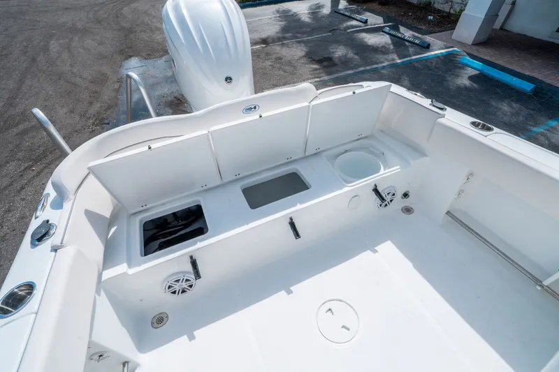 Slide: The Image of 2026 Sea Hunt Ultra 234 boat interior with storage compartments. - 12