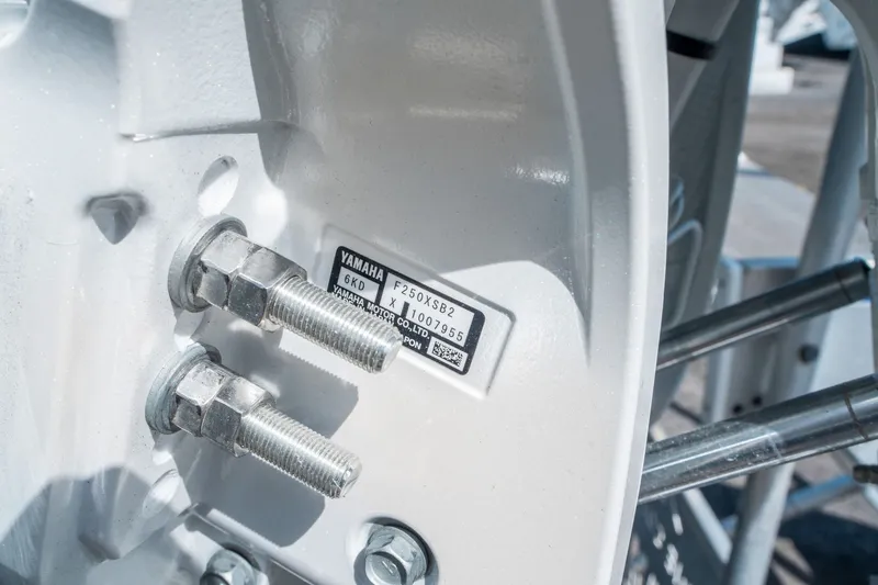Slide: The Image of Close-up of Yamaha engine bolts on Sea Hunt Ultra 234, year 2026. - 24