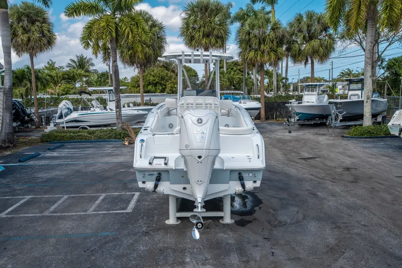 Slide: The Image of 2026 Sea Hunt Ultra 234 boat parked at marina. - 3