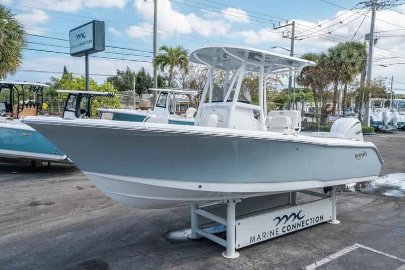 Slide: The Image of 2026 Sea Hunt Ultra 234 boat on display stand. - 6