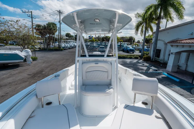 Slide: The Image of 2026 Sea Hunt Ultra 234 boat with seating area and sunshade. - 22