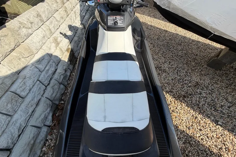Slide: The Image of 2018 Yamaha WaveRunner FX Cruiser HO with black and white seating, parked on gravel. - 4