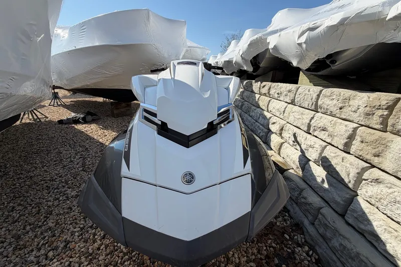 Slide: The Image of 2018 Yamaha WaveRunner FX Cruiser HO parked on gravel near covered boats. - 6