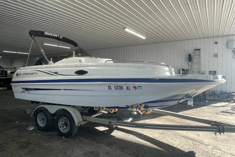 The Image of 2016 Starcraft Coastal 2009 OB boat on trailer in indoor storage. - 0