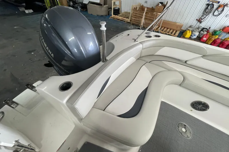 Slide: The Image of 2016 Starcraft Coastal 2009 OB boat interior with Yamaha outboard motor in a garage. - 14