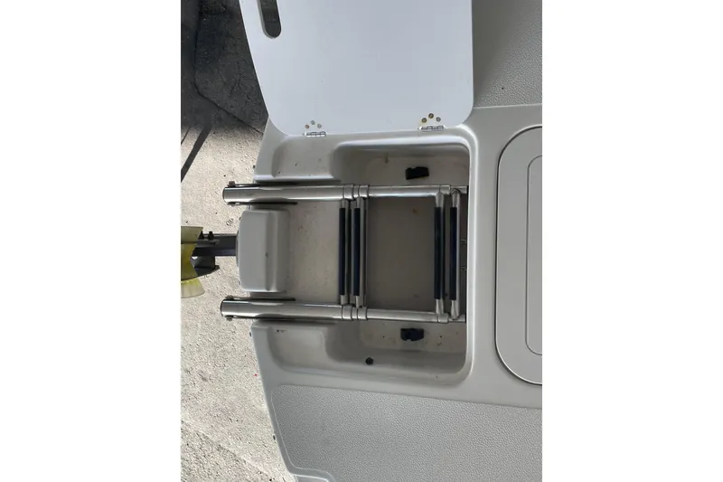 Slide: The Image of Starcraft Coastal 2009 OB 2016 boat ladder, folded and stored on deck. - 16