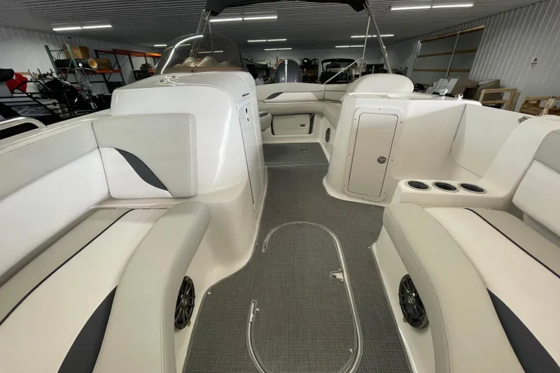 Slide: The Image of Interior of a 2016 Starcraft Coastal 2009 OB boat with seating and storage. - 18
