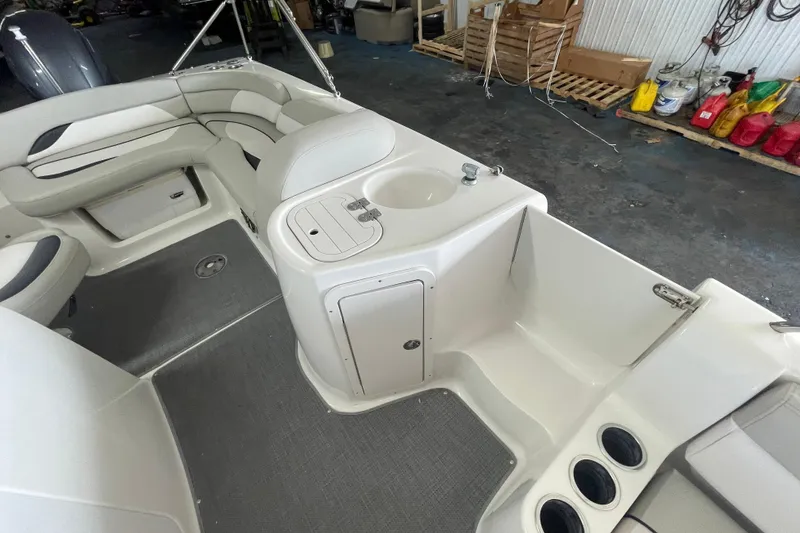 Slide: The Image of Interior of 2016 Starcraft Coastal 2009 OB boat with seating and storage compartments. - 2