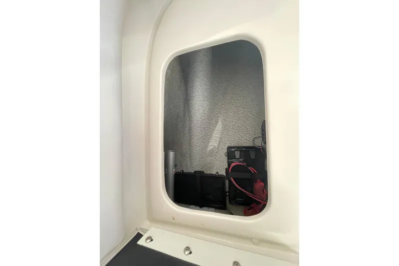 Slide: The Image of Interior view of a 2016 Starcraft Coastal 2009 OB boat compartment with wiring. - 22