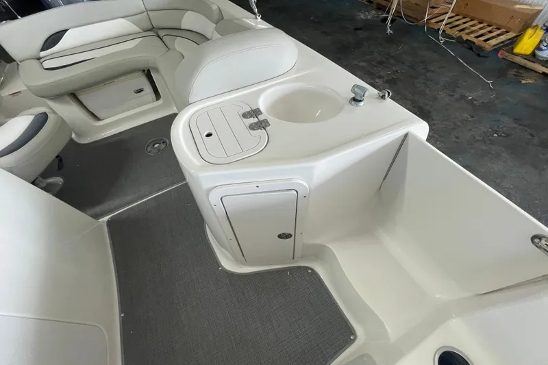 Slide: The Image of Interior of 2016 Starcraft Coastal 2009 OB boat with seating and sink area. - 4