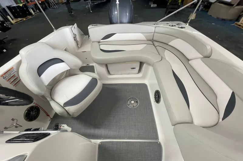 Slide: The Image of Interior of 2016 Starcraft Coastal 2009 OB boat with white and gray seating. - 9