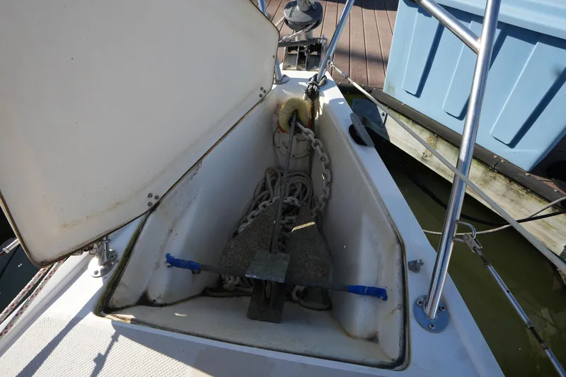 Slide: The Image of Anchor locker of a 1988 Catalina 27 sailboat with chain and rope. - 4