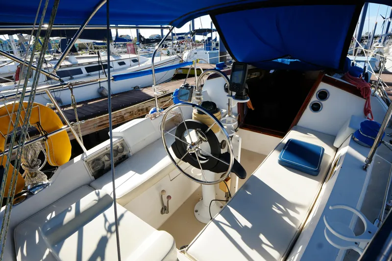 Slide: The Image of Cockpit of a 1988 Catalina 27 sailboat docked at a marina. - 7