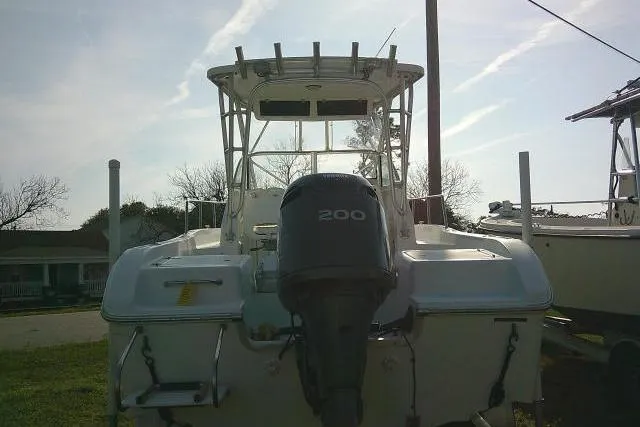 Slide: The Image of 2005 Sea Pro boat with 200 horsepower engine, docked outdoors. - 12