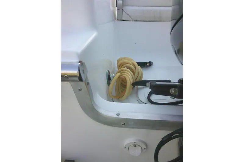 Slide: The Image of 2005 Sea Pro boat interior with coiled hose and equipment. - 15