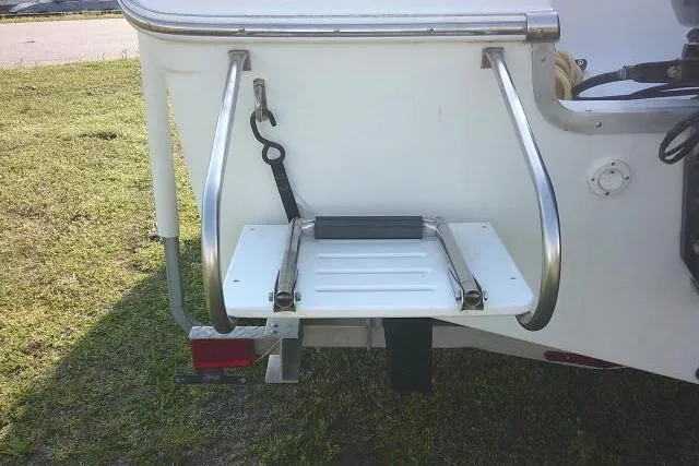 Slide: The Image of 2005 Sea Pro boat with a foldable swim platform and stainless steel handrails. - 16