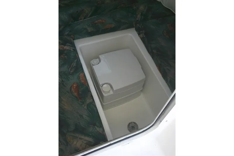Slide: The Image of 2005 Sea Pro boat interior with built-in storage compartment. - 24