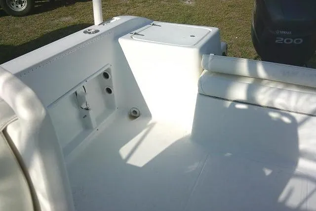 Slide: The Image of 2005 Sea Pro boat interior with seating and storage, featuring a Yamaha 200 outboard motor. - 25