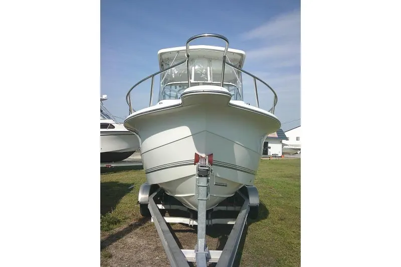 Slide: The Image of 2005 Sea Pro boat on trailer, front view, under clear blue sky. - 3