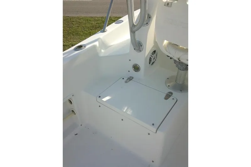 Slide: The Image of 2005 Sea Pro boat interior with storage compartment and seating area. - 33