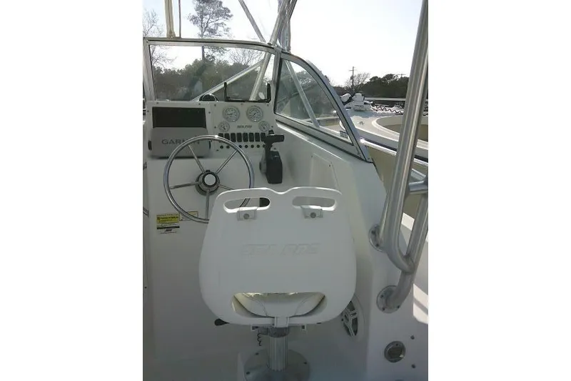 Slide: The Image of 2005 Sea Pro boat cockpit with steering wheel and controls. - 35