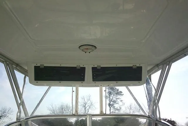 Slide: The Image of 2005 Sea Pro boat interior with overhead compartments and clear canopy view. - 37