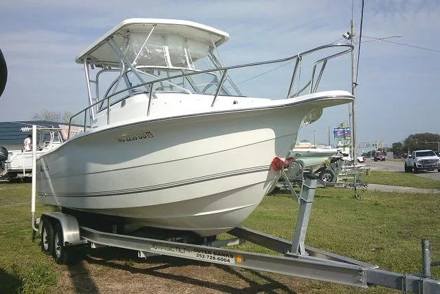Slide: The Image of 2005 Sea Pro boat on trailer, parked outdoors, side view. - 4