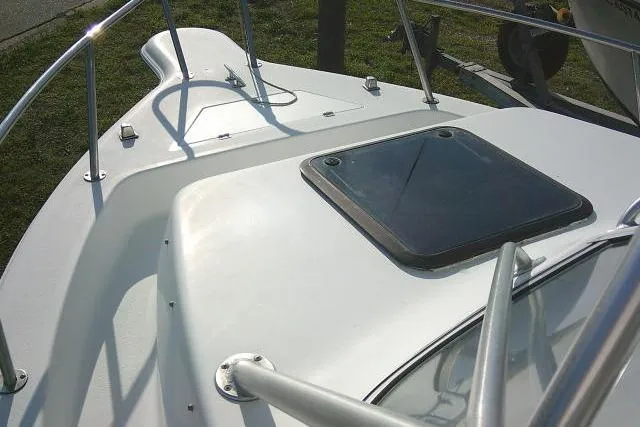 Slide: The Image of 2005 Sea Pro boat deck with hatch and railing in sunlight. - 46