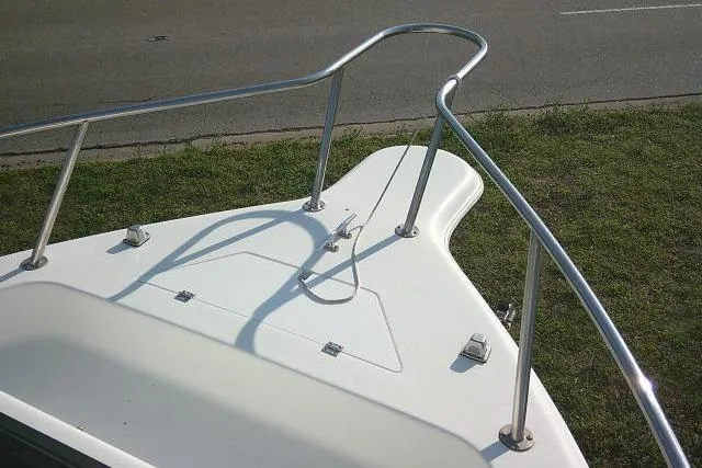 Slide: The Image of 2005 Sea Pro boat bow with stainless steel railings and anchor setup. - 47
