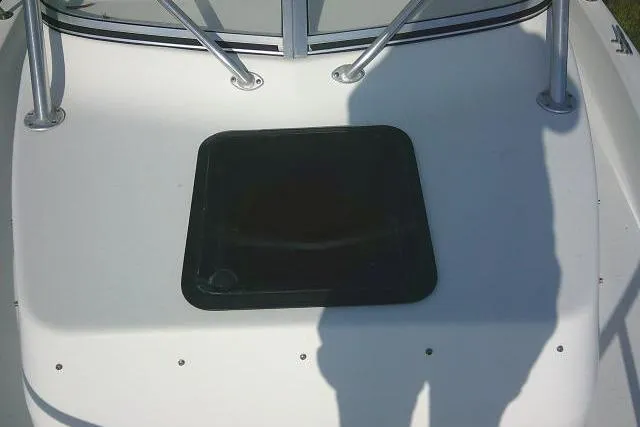 Slide: The Image of 2005 Sea Pro boat deck with hatch and railing shadows. - 48