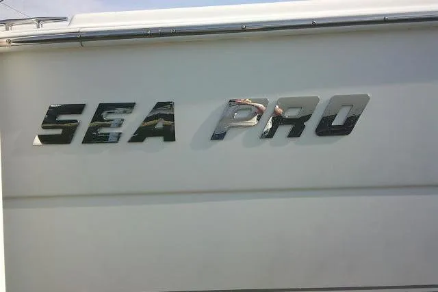 Slide: The Image of 2005 Sea Pro boat logo on white surface, chrome lettering. - 7