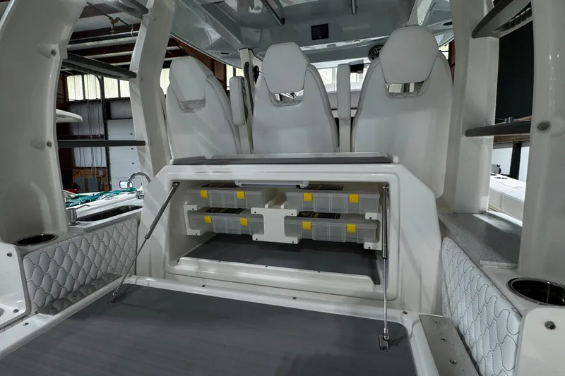 Slide: The Image of Interior view of 2025 Solace 37CS boat with seating and storage compartments. - 22