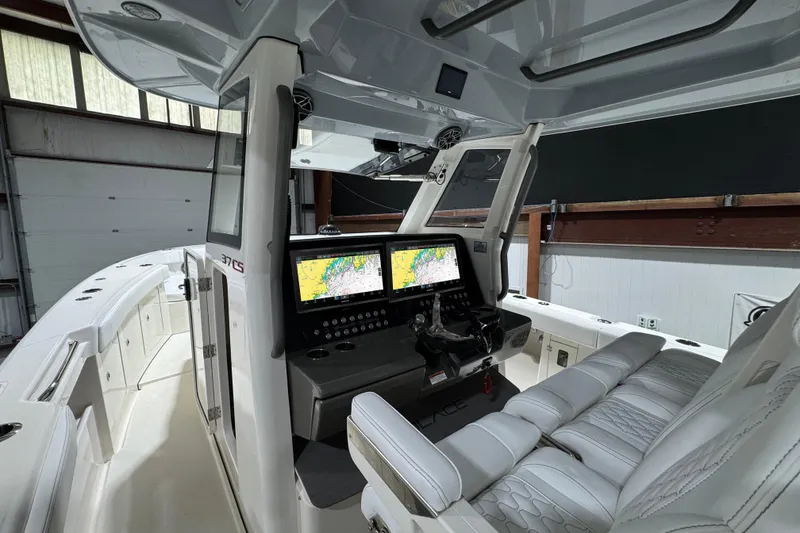 Slide: The Image of Interior of 2025 Solace 37CS boat with advanced navigation system and luxurious seating. - 24