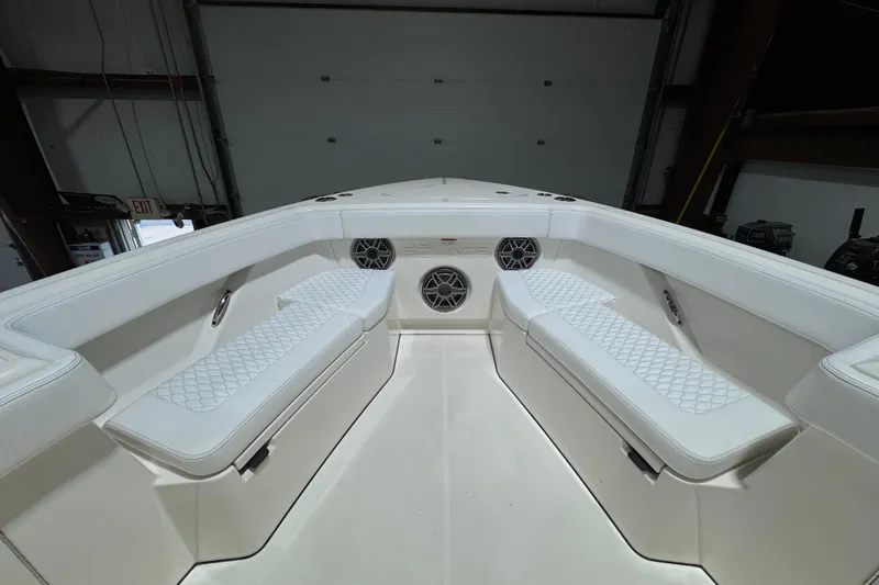 Slide: The Image of Interior view of 2025 Solace 37CS boat with white seating and speakers. - 28