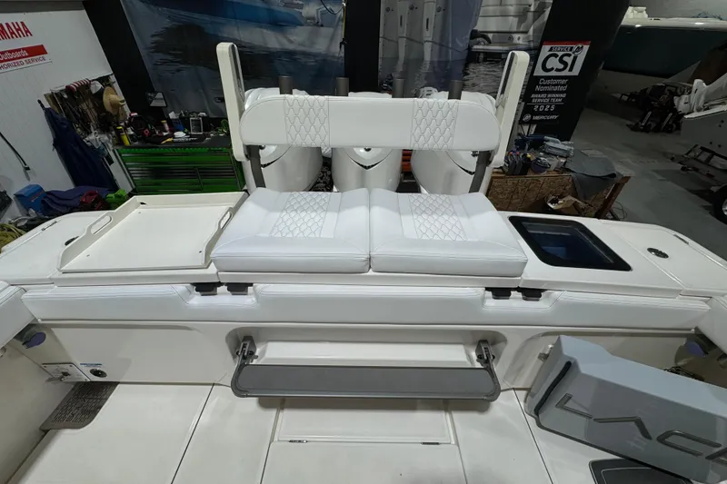 Slide: The Image of 2025 Solace 37CS boat interior with white seating and storage compartments. - 29
