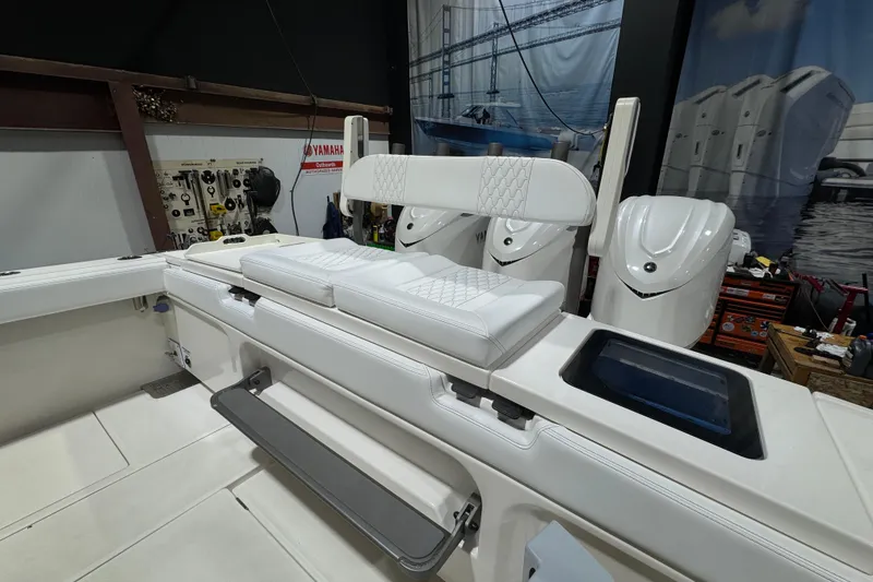 Slide: The Image of 2025 Solace 37CS boat interior with white seating and Yamaha outboard engines. - 30