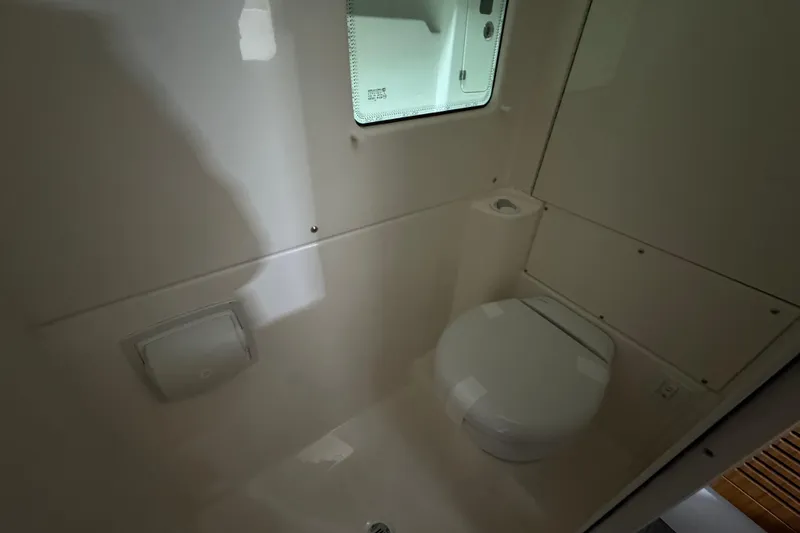 Slide: The Image of Modern bathroom interior in 2025 Solace 37CS boat, featuring compact toilet design. - 34