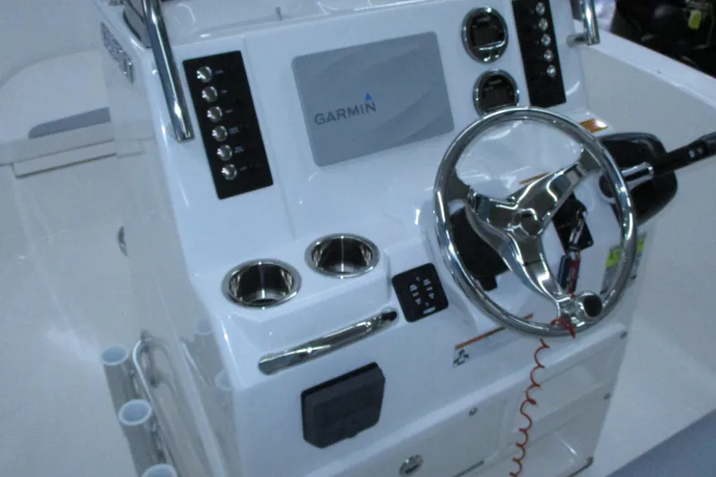 Slide: The Image of 2021 Robalo R180 Center Console with Garmin display and steering wheel. - 13