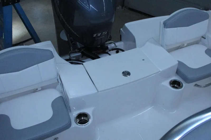 Slide: The Image of 2021 Robalo R180 Center Console boat interior with seating and motor. - 5