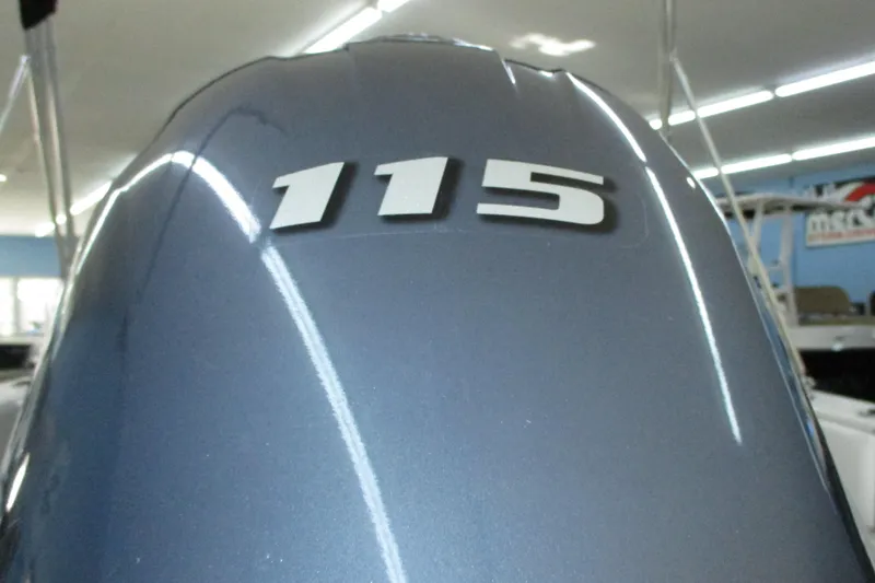 Slide: The Image of 2021 Robalo R180 Center Console boat with "115" engine detail. - 7