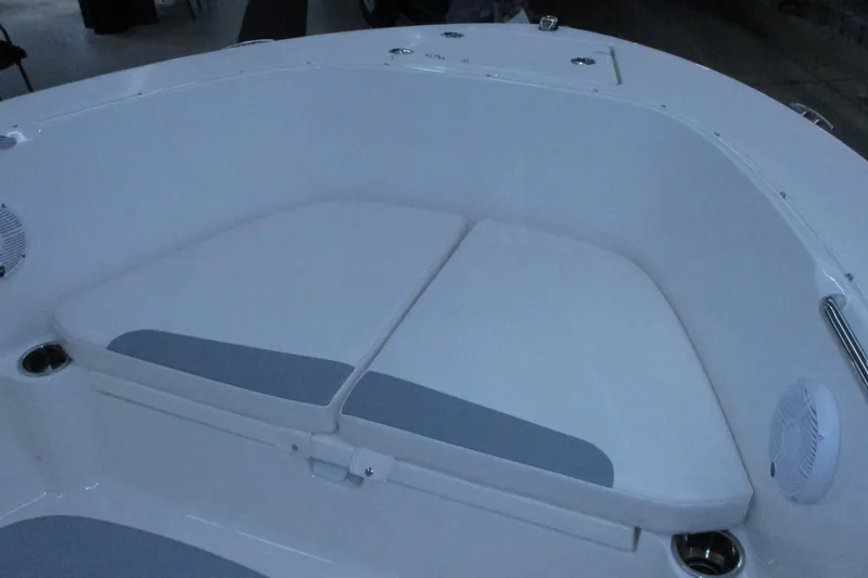 Slide: The Image of 2021 Robalo R180 Center Console boat interior with cushioned seating. - 8