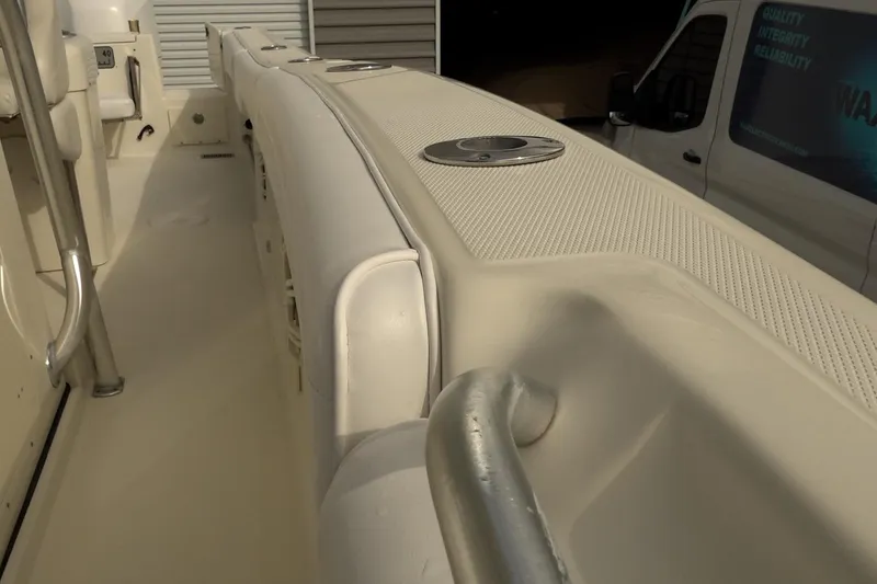 Slide: The Image of 2008 Hydra-Sports Vector 2900 CC boat interior with seating and railing details. - 13