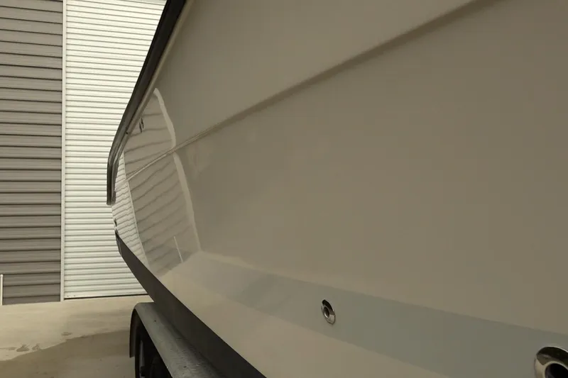 Slide: The Image of 2008 Hydra-Sports Vector 2900 CC boat hull, parked near a garage. - 17